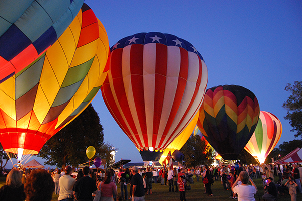 hot air balloons being flown in natchez festival